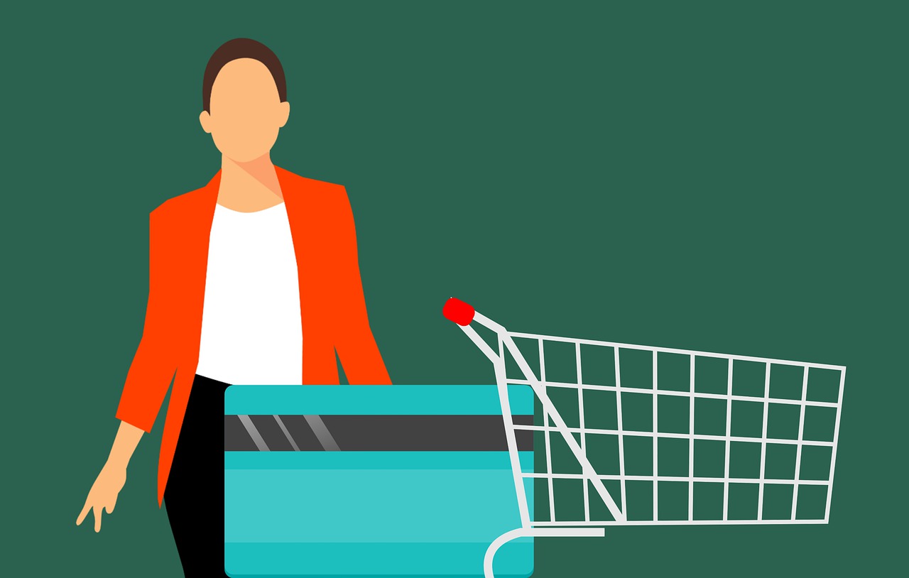 image of a woman with a card and shopping trolley