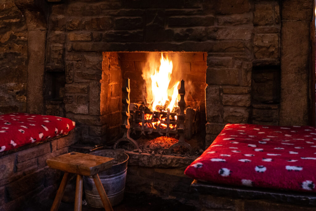 Two seats beside a fire in a traditional English pub - The Bull, Ambridge